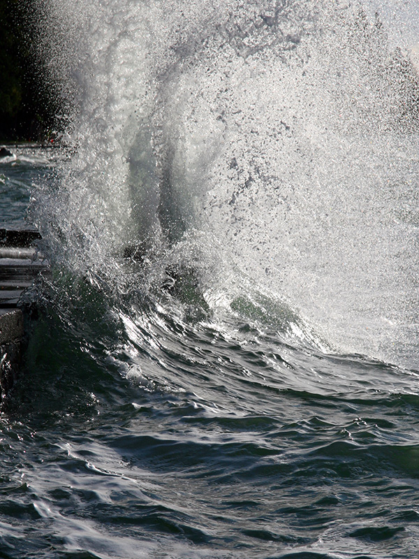 Water erupts on sea wall
